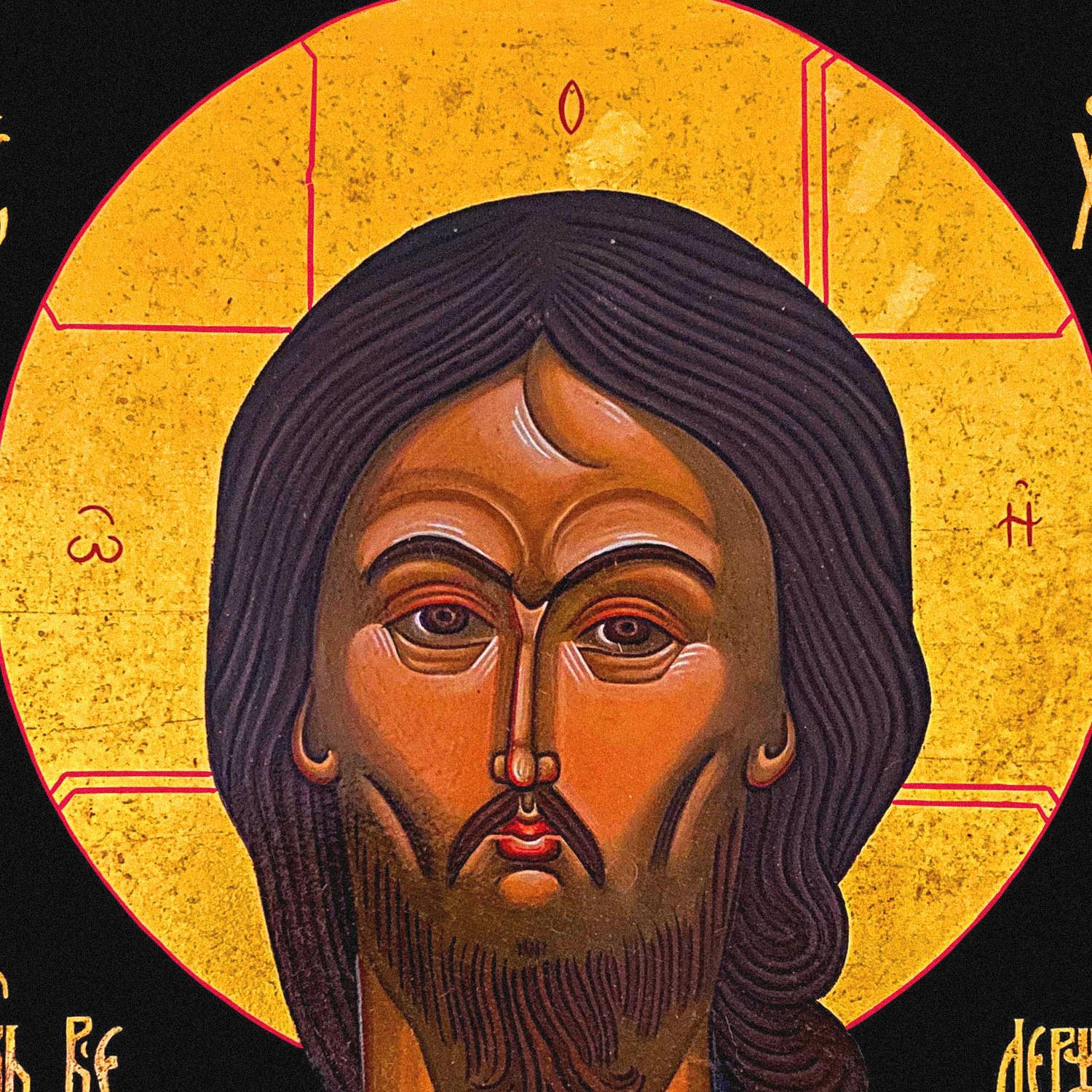 Detail of the print of the black unisex long-sleeve t-shirt with a large, full-color reproduction of the Russian Orthodox icon "Christ with the Angry Gaze." www.arthodox.com