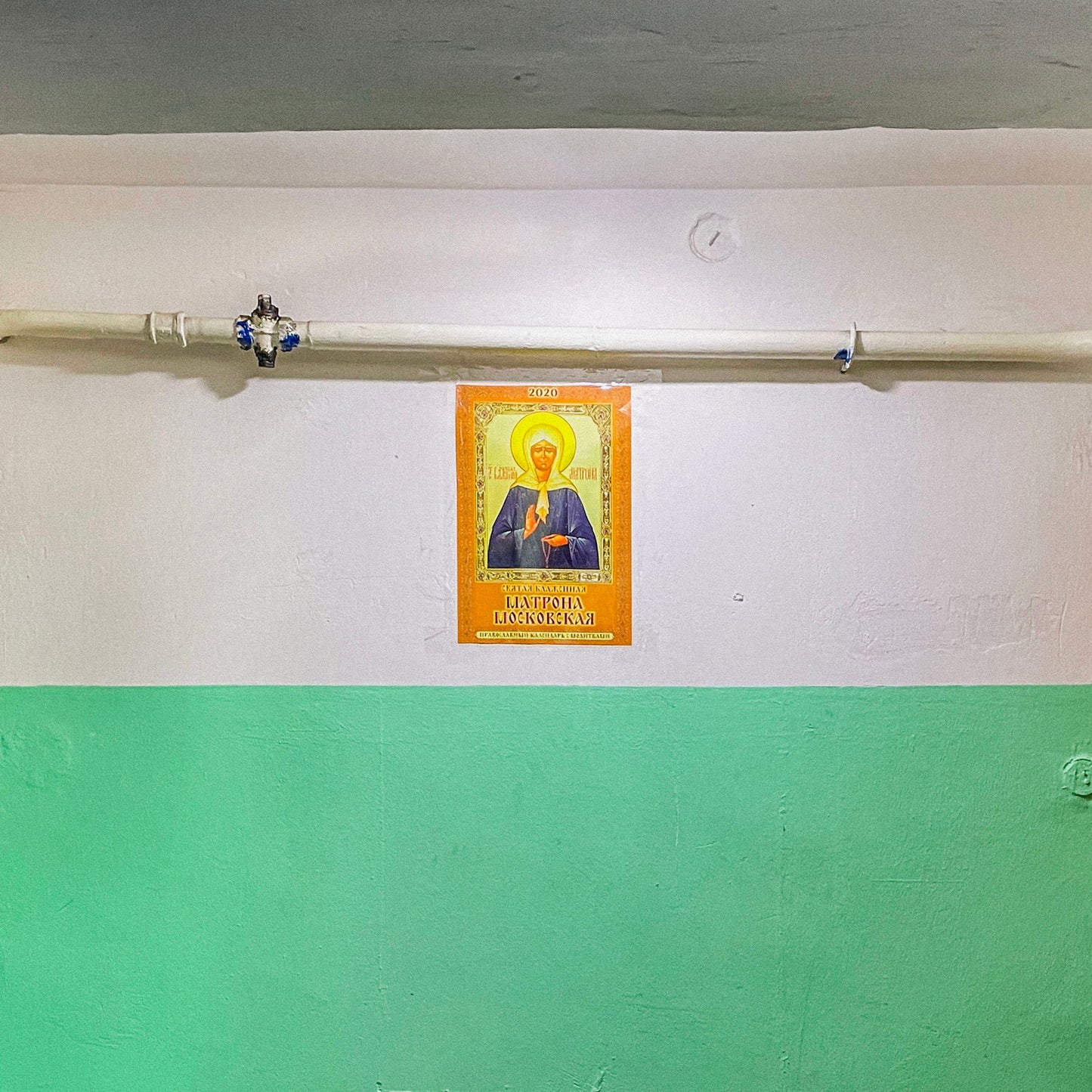 Large 91x61cm print depicting a typical Russian apartment stairwell featuring an icon of Holy Blessed Matrona of Moscow on the wall. Closeup print detail. From arthodox.com